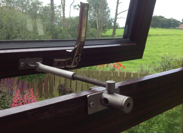 locklatch installed on wooden window