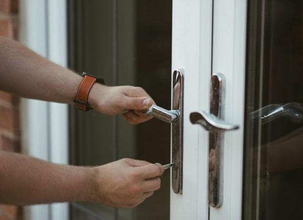 using a key to unlock patio door