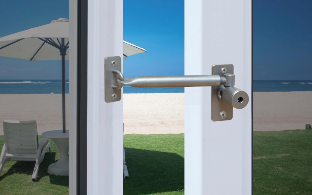 locklatch in pvc door with view of the beach