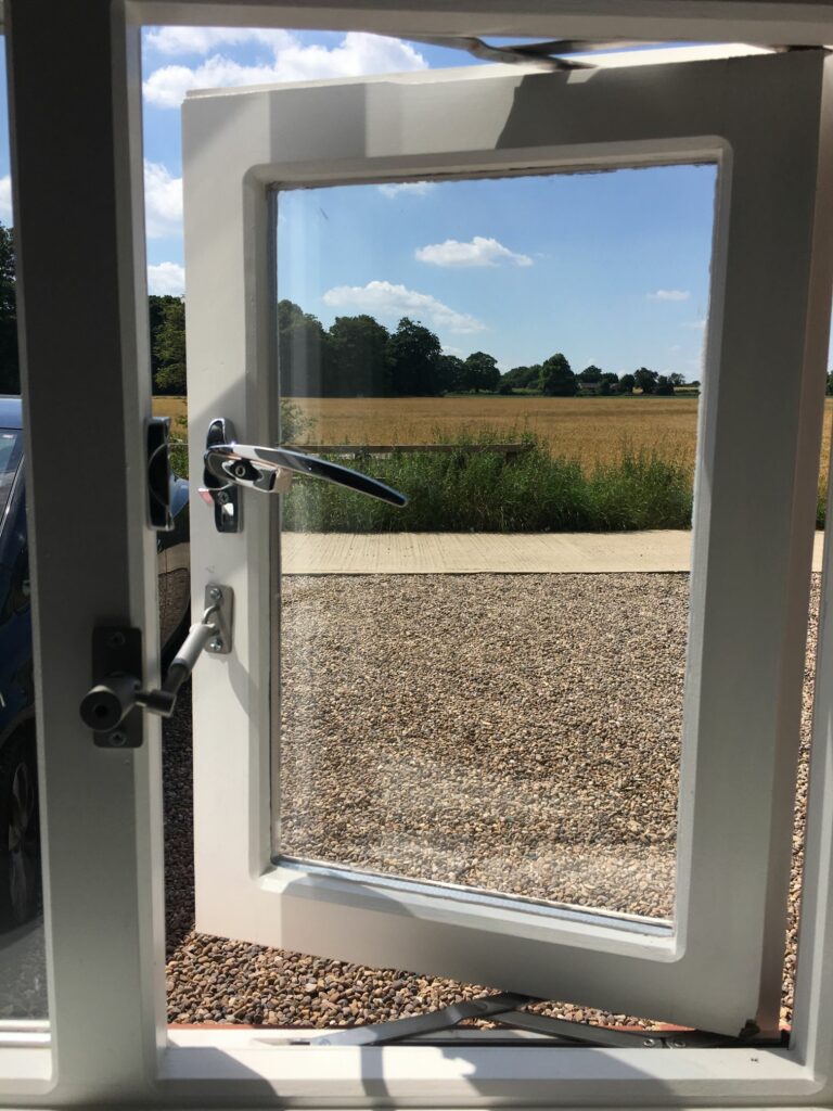 locklatch installed on wooden window locking it open