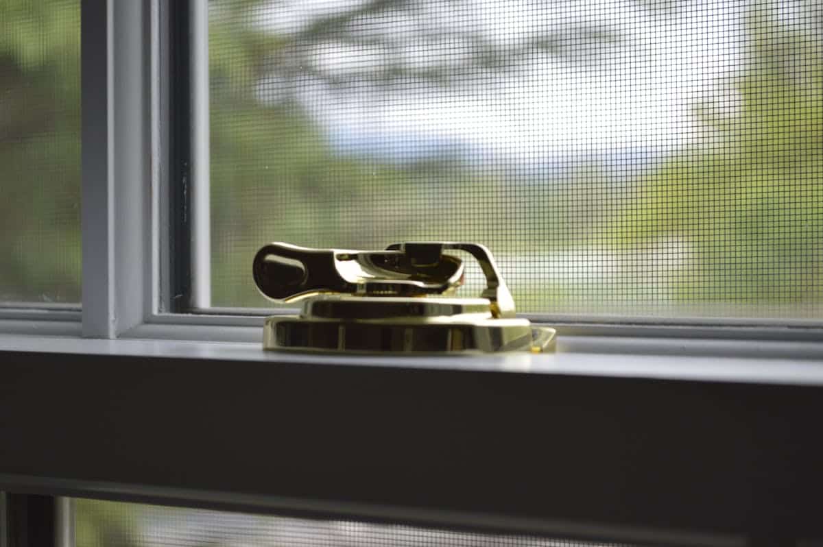 Window lock for rental property showing LockLatch installed on UK window